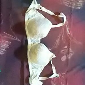 Cream and white lace bra
